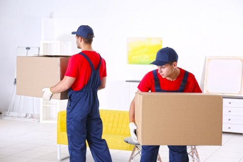 Man and van moving furniture in a Hampstead residential street