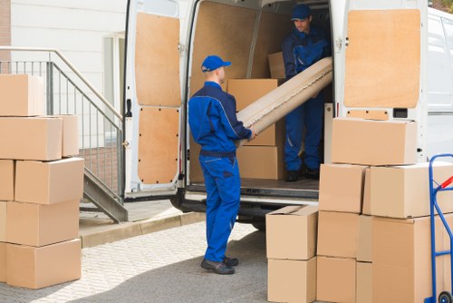 Removal team planning a house move on a Hampstead residential street