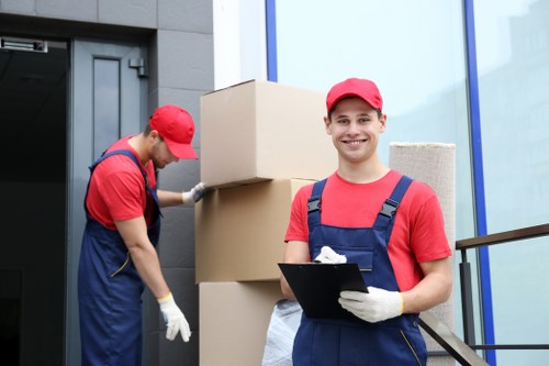 Packing and loading furniture into a moving truck in Hampstead