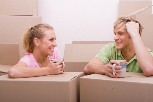 Careful house move in Hampstead with boxes and protected furniture