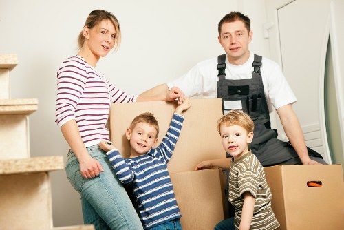 Local removals crew handling household furniture in Hampstead