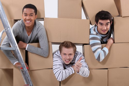 Local removal team preparing household items for transport in Hampstead