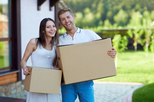 Packing and loading household items into a van in Hampstead
