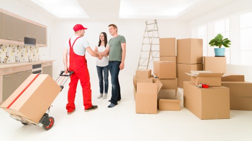 Loading boxes and household items into a van for a local Hampstead move