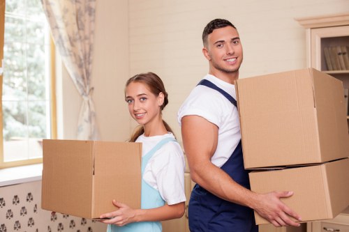 Trained staff handling boxes with care during a house move